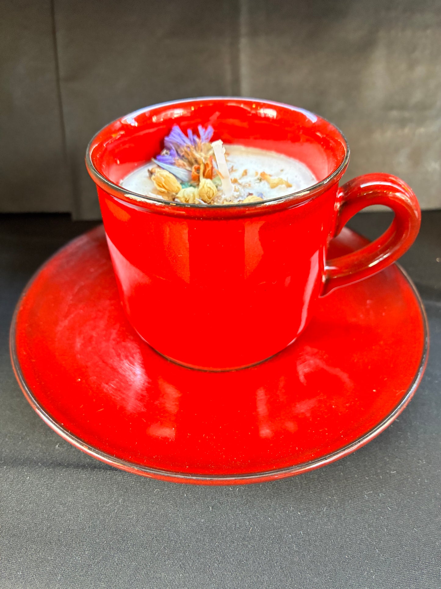 Handmade Vintage Teacup Candle scented with Red Velvet essential oils, topped with ￼botanicals, tailored to The Timeless Glow tone.