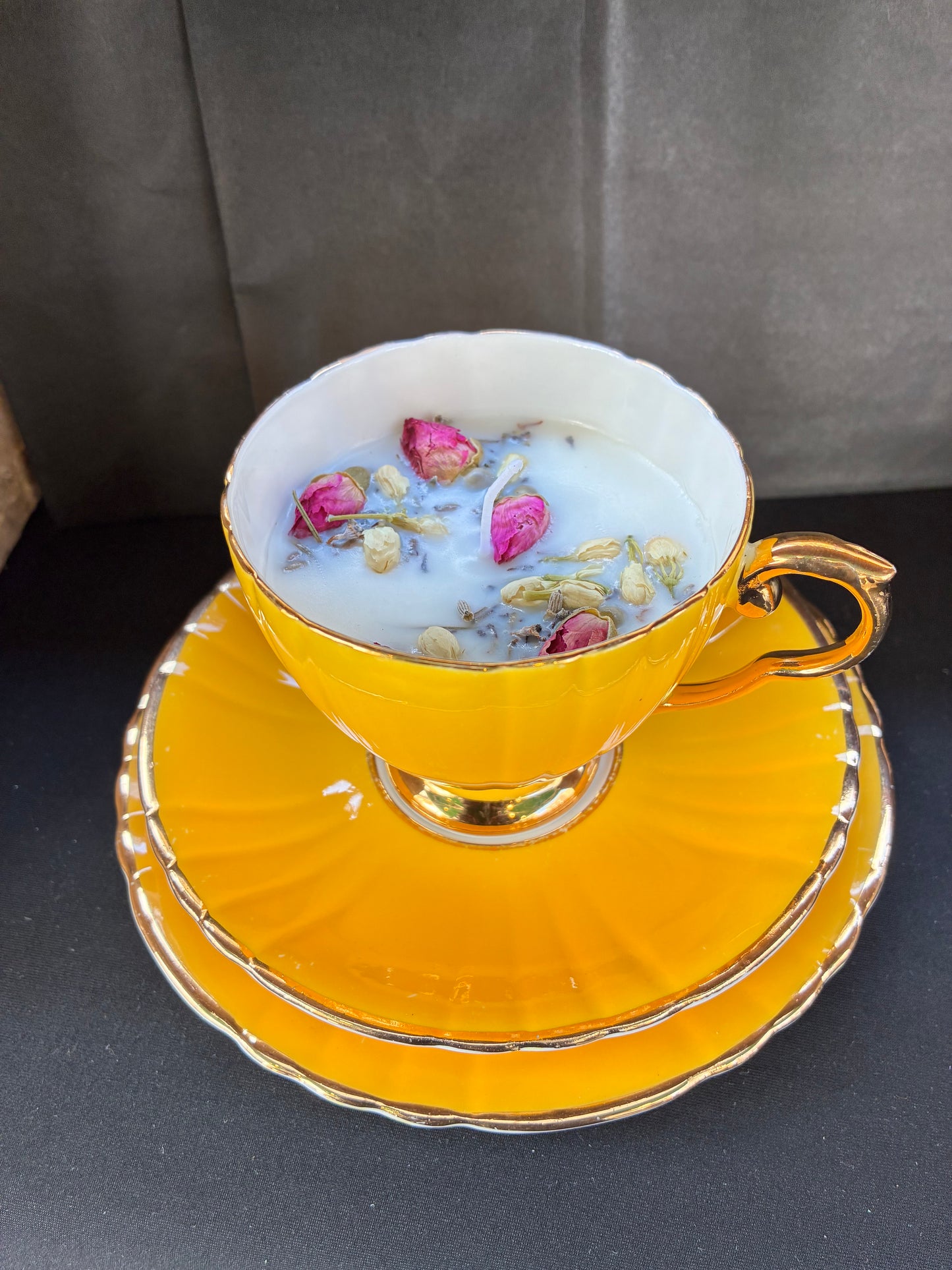 Hand poured Teacup Set Candle scented with yellow rose essential oils topped with dried botanicals, tailored to The Timeless Glow tone.