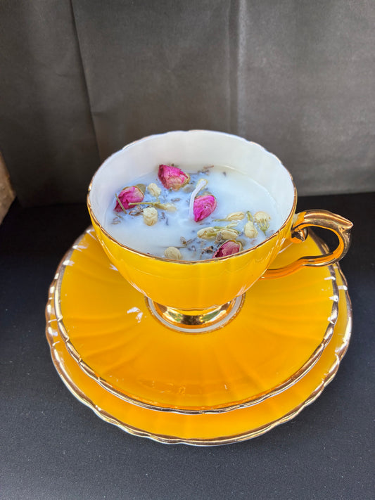 Hand poured Teacup Set Candle scented with yellow rose essential oils topped with dried botanicals, tailored to The Timeless Glow tone.