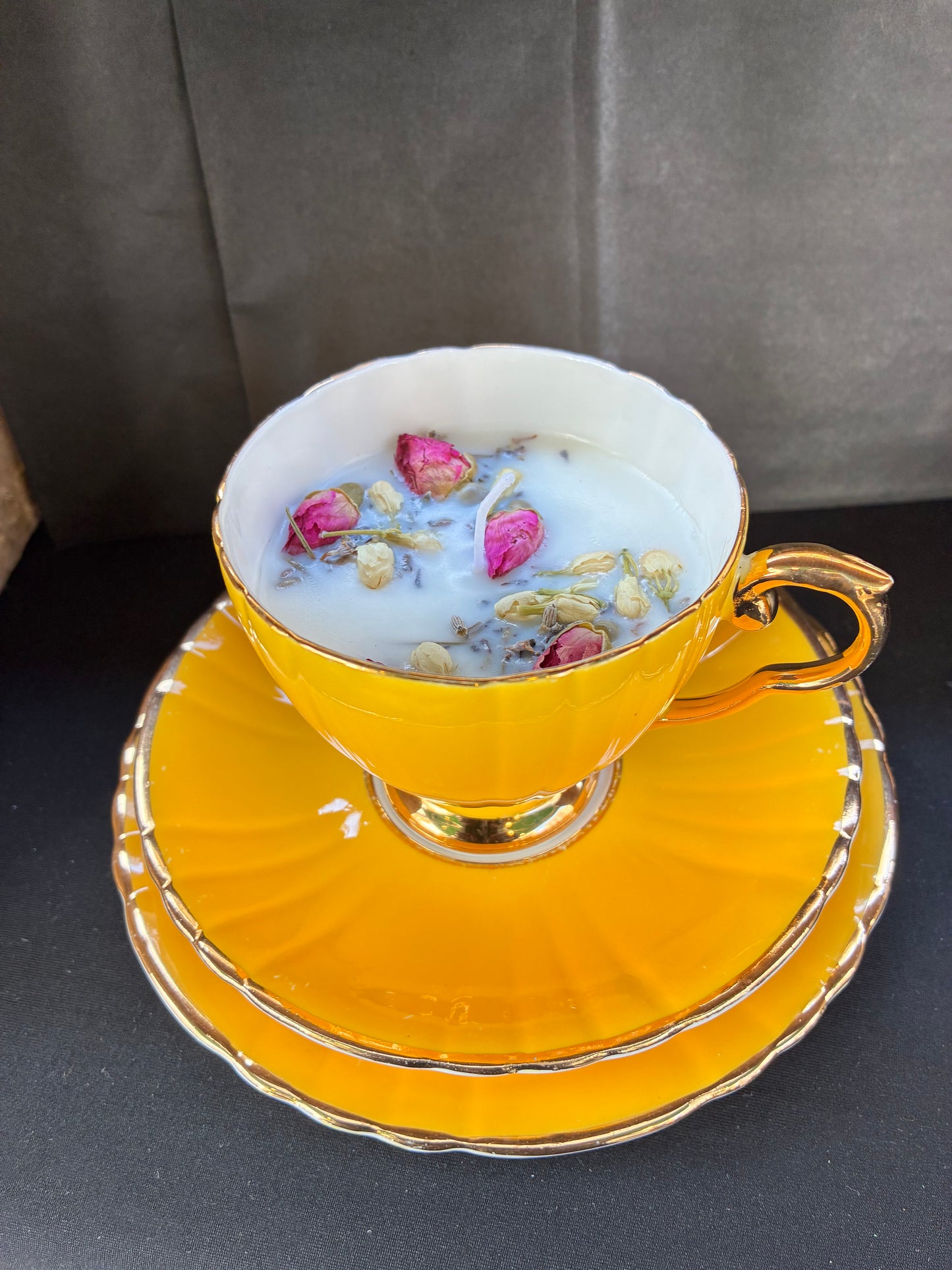 Hand poured Teacup Set Candle scented with yellow rose essential oils topped with dried botanicals, tailored to The Timeless Glow tone.