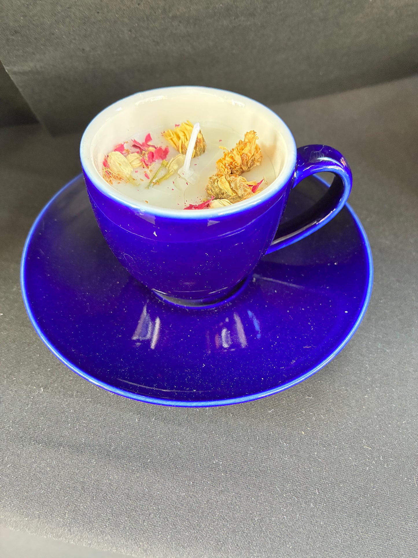 Hand poured Vintage Teacup Candle scented with blue rose essential oils topped with dried botanicals, tailored to The Timeless Glow tone.